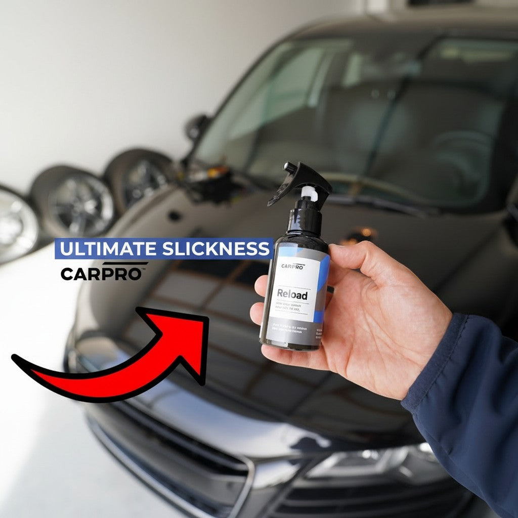 Planet Car Care CarPro Reload 2.0 spray sealant bottle held in hand in front of a glossy black car hood