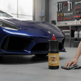 Planet Car Care Hyper Gloss liquid car wax bottle on a garage floor with a blue sports car in the background