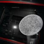 Planet Car Care CarPro rayon glass polishing pad attached to a buffer, used for removing water spots from car windows.