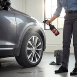 Planet Car Care Rim Raider non-acid wheel and tyre cleaner being sprayed onto a grey car wheel in a garage
