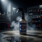 Planet Car Care Ultimate Degreaser in a reusable spray bottle, shown in a professional auto detailing workshop.