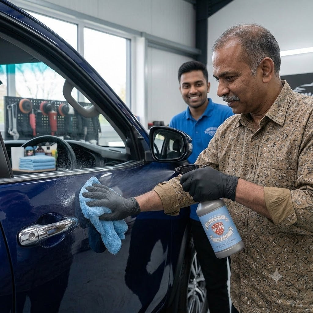 Man using Planet Car Care Eco Gloss waterless wash spray and microfiber cloth to clean a dark blue car door